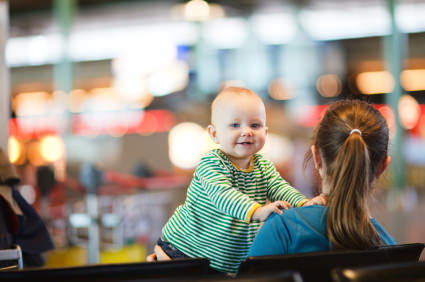 Mother And Baby At Airport.