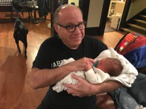 Grandpa holds grandson